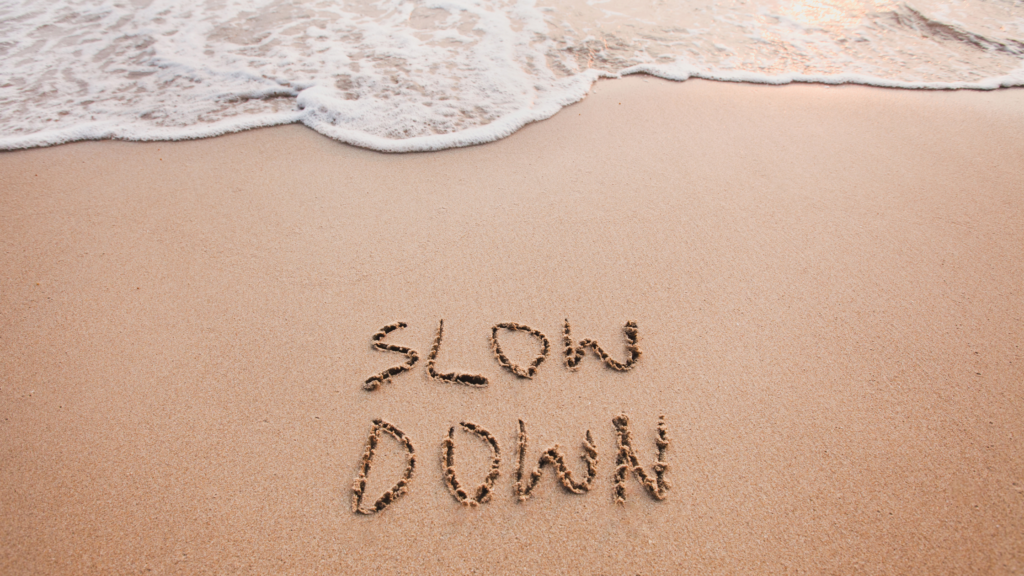picture that says Slow Down which is an important virtue in mindfulness and meditation