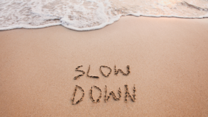picture that says Slow Down which is an important virtue in mindfulness and meditation